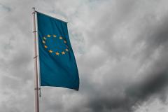 EU-flag under cloudy sky