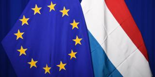 A European flag and a Luxembourgish flag