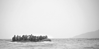 Refugees on a boat crossing the Mediterranean sea
