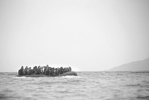 Refugees on a boat crossing the Mediterranean sea